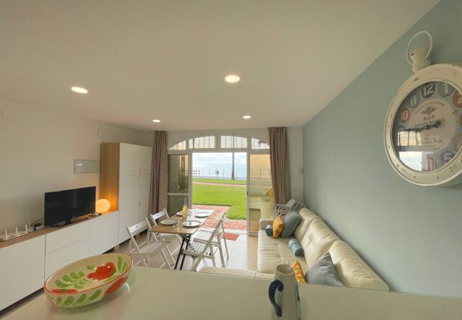 sofa bed - international TV - dining table - modern decoration - beach and sea views.